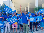 DA supporters outside the Durban ICC on Wednesday ahead of an eThekwini full council meeting which will vote on a dissolution of the council based on the ANC's 'failures'. 