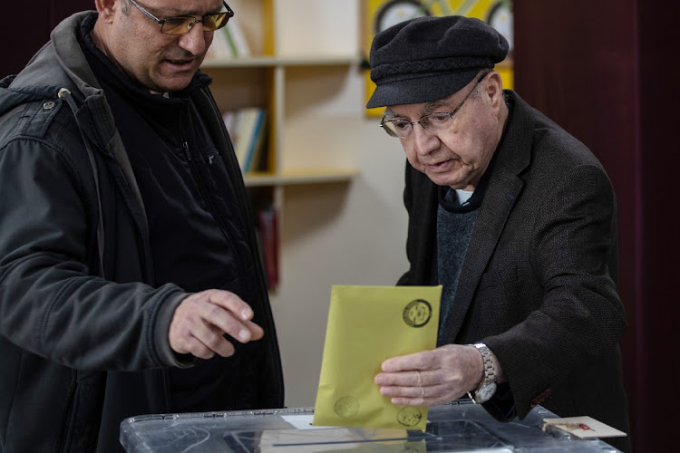 People arrive to cast their votes at a polling station during Turkey's General Election on May 14, 2023 in Ankara, Turkey.