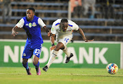 Onismor Bhasera of SuperSport United and Tumelo Makha of Tshakhuma Tsha Madzivhandila FC during the Nedbank Cup quarter final match between Tshakhuma Tsha Madzivhandila FC and SuperSport United at Thohoyandou Stadium on April 08, 2022 in Thohoyandou, South Africa.