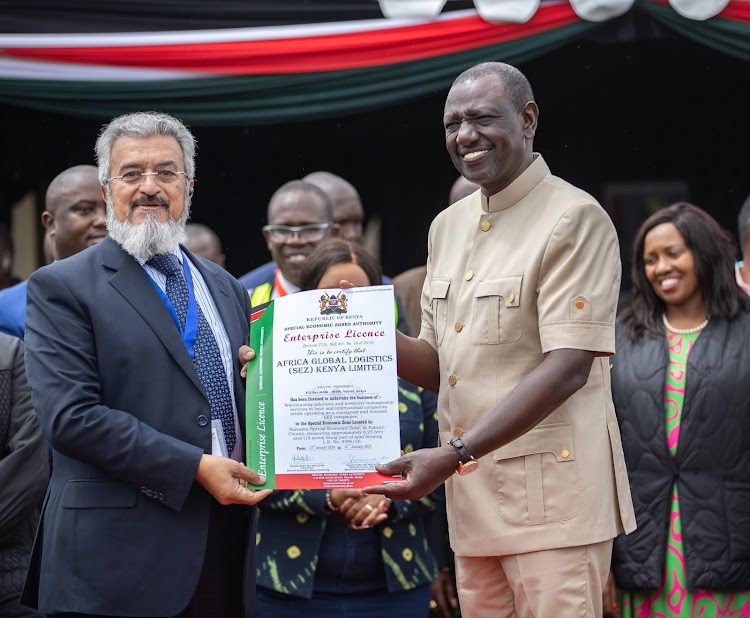 President William Ruto issues an enterprise licence to one of the directors of a company setting up at the Naivasha Special Economic Zone on January 13, 2024.