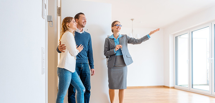 Realtor showing house to a young couple wanting to rent it