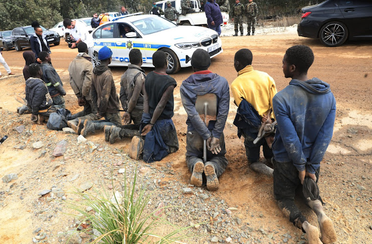 Police arrested a large number of illegal miners at Randfontein, West Rand, on Tuesday.