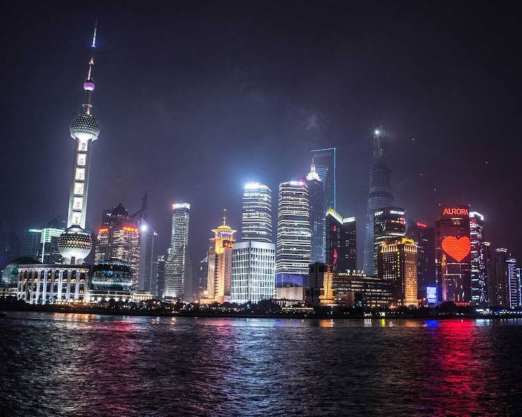 Shanghai's Pudong skyline and the Huangpu River at night, in a shot taken from the Bund.