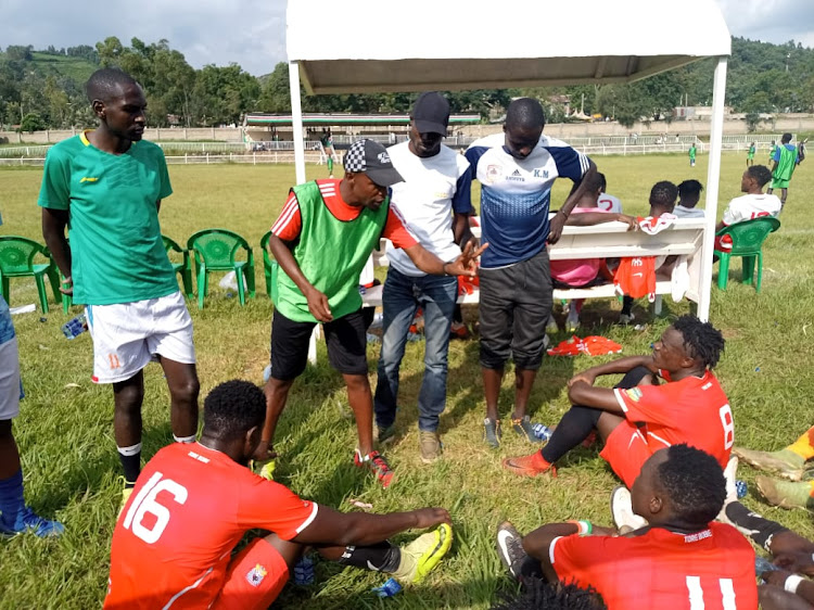 Shabana coach Robert Ojienda gives tips to his players in a recent game against MCF.