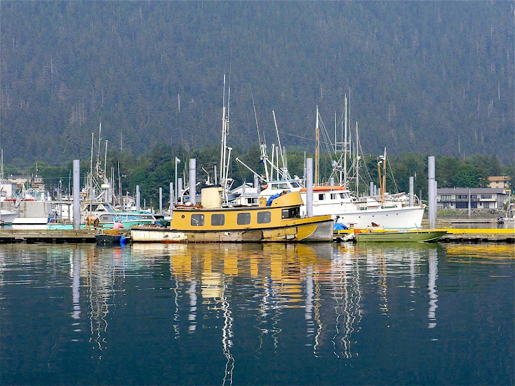 Boats in the calm waters of Sitka Harbor, Alaska. 