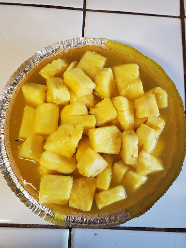 Fresh Pineapple chunks with a pineapple glaze on a graham cracker crust.