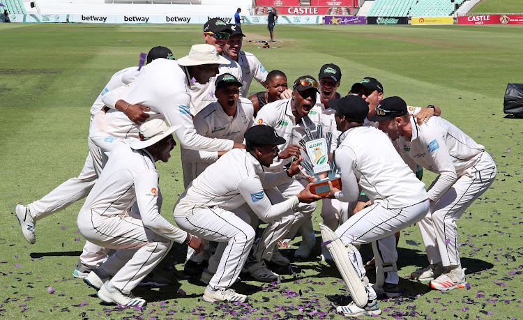 The Hollywoodbets Dolphins celebrates lifting the CSA 4-Day Domestic Series trophy.