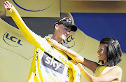 SKY'S THE LIMIT: Race leader Chris Froome gets the yellow jersey after yesterday's penultimate stage of the Tour de France