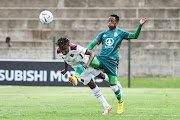 Ibraheem Jabaar of Stellenbosch FC and Msindisi Ndlovu of Amazulu FC during the DStv Premiership match between AmaZulu FC and Stellenbosch FC.