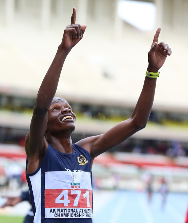 Daniel Simiu reacts after winning the men's 5000m at the AK national championships