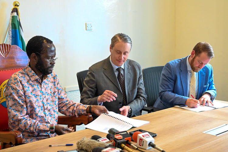 Kisumu Governor Anyang Nyong’o with United Green Chief Investment officer Albrecht Frischenschlager during the signing of the Sh30 billion agriculture and food security investment programme on Tuesday, October 4.