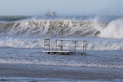 A huge storm with gale force winds drove long lines of huge waves down the coast, causing one death and damage to infrastructure and properties. 