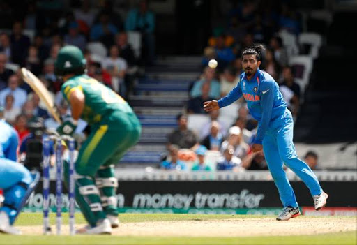 India's Ravindra Jadeja bowls to South Africa's Francois Duminy