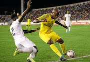 Andy Yiadom of Ghana challenges Sfiso Hlanti of SA in the 2021 Afcon qualifier in Ghana on November 14 last year. The teams are also in the same group in the 2022 World Cup qualifiers.    