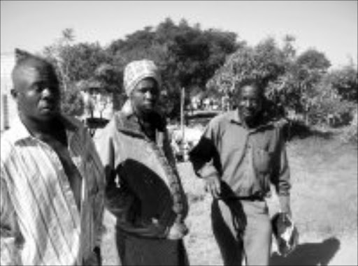 FAKE PREGNANCY: Afrika Mathebula and his wife Jennifer Nxumalo with Nelson Mathebula senior. Nxumalo faked pregnancy to please her in-laws who had threatened to chase her away if she did not bear a child soon. The couple even planned to run away but their secret was discovered just before they could flee to another place. Pic. Riot Hlatshwayo. 07/05/08. © Sowetan.