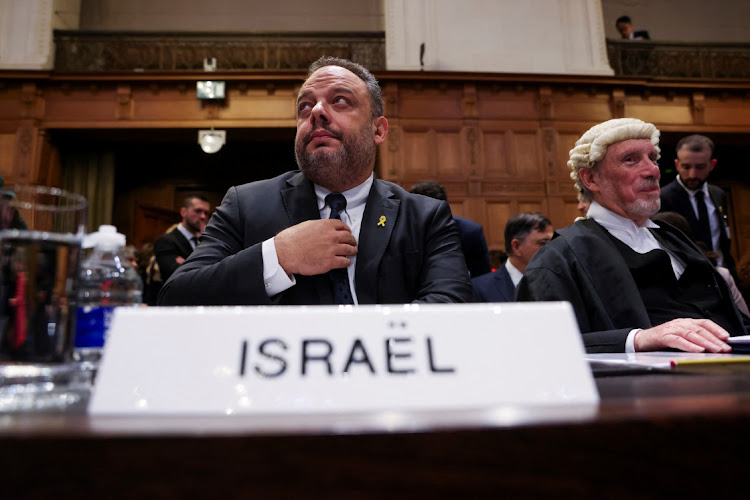 Legal adviser to Israel's foreign ministry Tal Becker and British jurist Malcolm Shaw sit inside the International Court of Justice (ICJ) as judges hear a request for emergency measures to order Israel to stop its military actions in Gaza, in The Hague, Netherlands on January 12 2024.