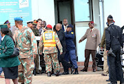 EFF leader Julius Malema confronts security who stopped his vehicle from entering the Fourways Memorial Park where Winnie Madikizela-Mandela was being buried on April 14 2018. 