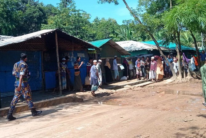 Law enforcement personnel secure the area at Kitupalong Refugee camp in Ukhia on September 30, 2021.