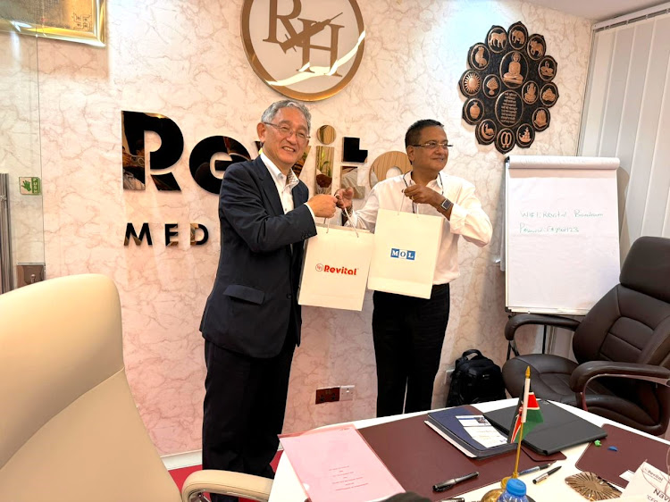 Mol logistics company President Koichi Yashima with Revital Healthcare's chairman Rajni Vora (right) at Revital’s manufacturing plant in Kikambala, Kilifi county.