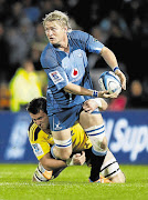 Bulls flank Dewald Potgieter is tackled by Jeremy Thrush of the Hurricanes. Potgieter has recovered from his injury and will play for the Bulls against the Chiefs on Friday