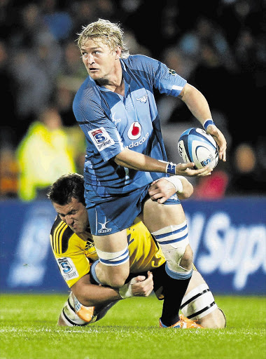 Bulls flank Dewald Potgieter is tackled by Jeremy Thrush of the Hurricanes. Potgieter has recovered from his injury and will play for the Bulls against the Chiefs on Friday