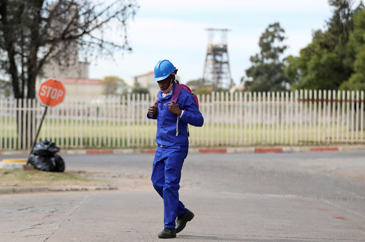 A mineworker walks at the end of his shift at the Sibanye-Stillwater mine in Carletonville. Picture: REUTERS/SIPHIWE SIBEKO