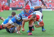 Schalk Brits executes a try saving tackle to deny Nic Groom during a Super Rugby match between the Emirates Lions and the Vodacom Bulls at Ellis Park in Johannesburg on March 2 2019.    