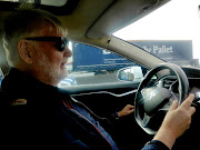 Taxi driver Trond Soemme drives his electric taxi in Oslo, Norway.