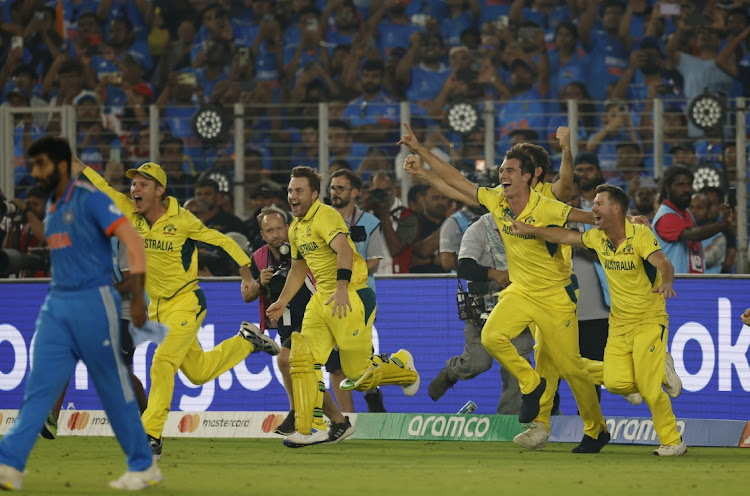 Australia players celebrate winning the 2023 ICC Cricket World Cup after the final against India at Narendra Modi Stadium in Ahmedabad, India on Sunday.