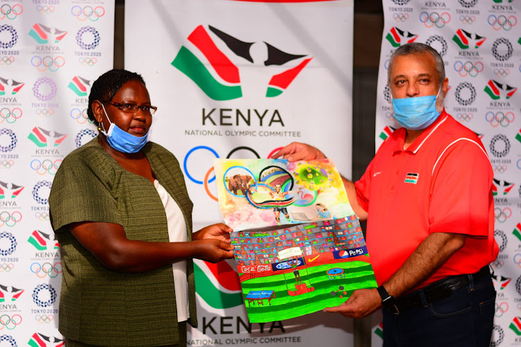 Dr. Purity Nthiga (L) with Sports for All Commission chairman Shoaib Vayani during the announcement of Nock Art and Essay competition winners at NOCK offices