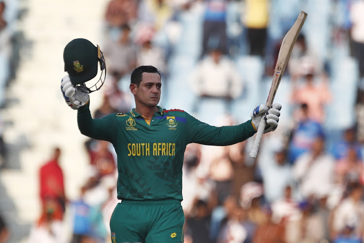 Quinton de Kock celebrates going to his 19th ODI century, which helped South Africa to a total of 311/7 in their World Cup match against Australia at Ekana Cricket Stadium in Lucknow, India, on Thursday.