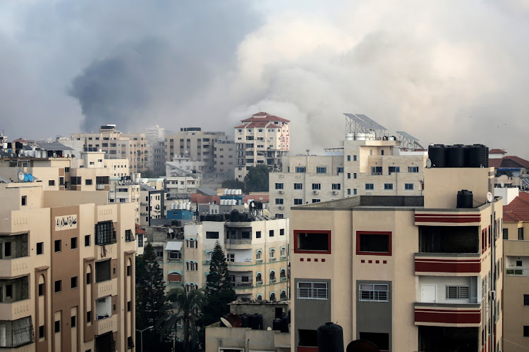 Israeli aircraft bomb the Carmel residential tower on October 11 2023 in Gaza City. Israel's military has called for all civilians of Gaza City to relocate south within 24 hours.
