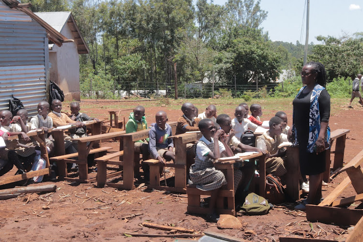 Ndhiwa Hospital Primary School deputy head teacher with pupils on September 26, 2022.