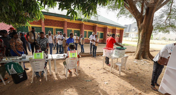 Former President Uhuru Kenyatta and the team of election observers at a polling station in Abuja, Nigeria on February 25,2023.