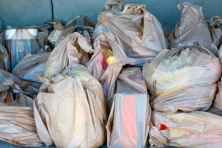 Plastic bags full of groceries.