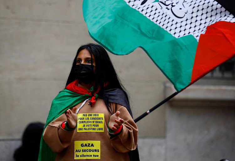 A student holds a Palestinian flag during a protest. Picture: REUTERS/Sarah Meyssonnier