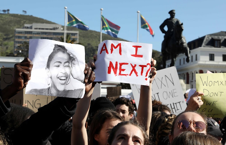 Academics and students from the University of Cape Town gather outside parliament to picket against gender-based violence on September 5 2019.