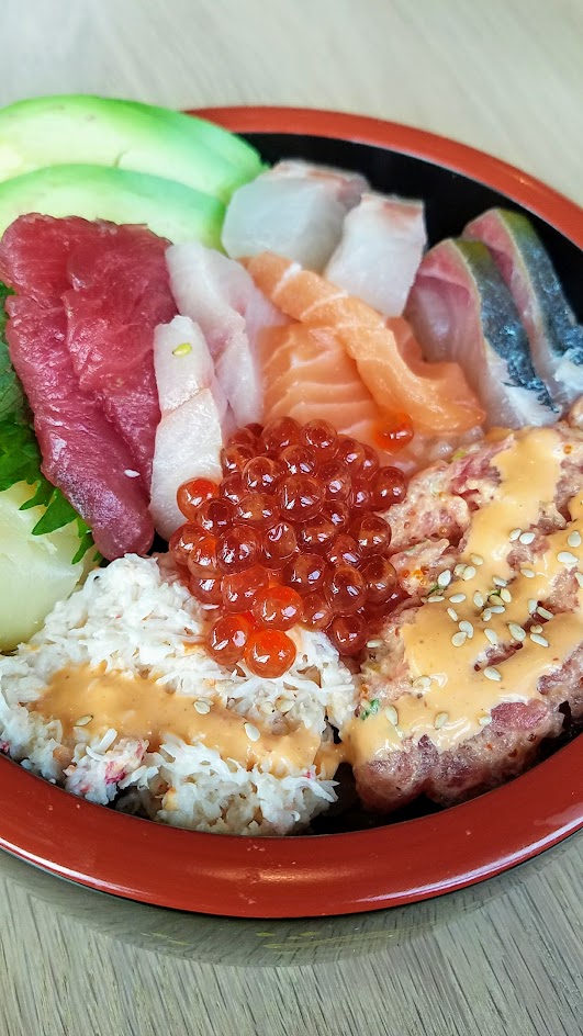 Chirashi Bowl from Afuri with big eye tuna, yellowtail, striped jack, salmon, sea bream, salmon roe, spicy tuna, California crab, avocado, seaweed, and pickled ginger