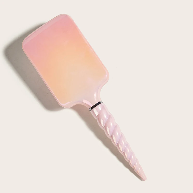 Brosse de massage à coussin d'air Rainbow pour la maison, lisse les cheveux et offre un coiffage confortable et sain grâce à son coussin d'air.