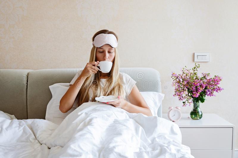 Beautiful Happy Young Woman Drinking Cup of Coffee or Tea while Lying in  Bed after Waking Up in Morning. Portrait of Smiling Stock Photo - Image of  person, comfort: 157786856