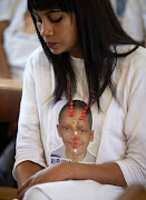 Raylene Louw wearing a t-shirt bearing the face of Miguel Louw.