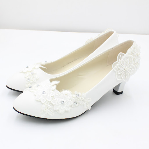 Title 2, White oversized wedding shoes with square heels...