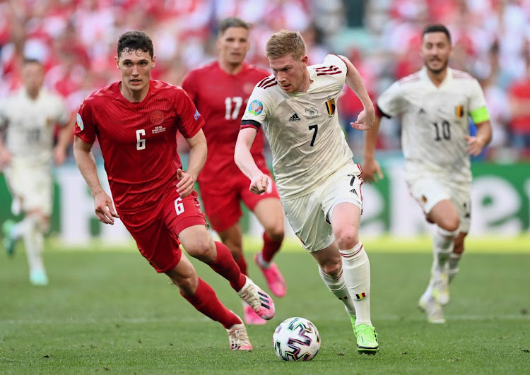 Kevin de Bruyne of Belgium runs with the ball under pressure from Andreas Christensen of Denmark during their Uefa Euro 2020 Championship Group B match at Parken Stadium on June 17 2021 in Copenhagen, Denmark.