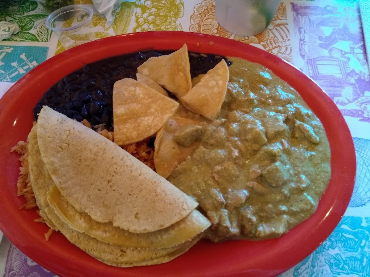 Pork mole Verde with black beans, Spanish rice and the best corn tortillas I've ever had.