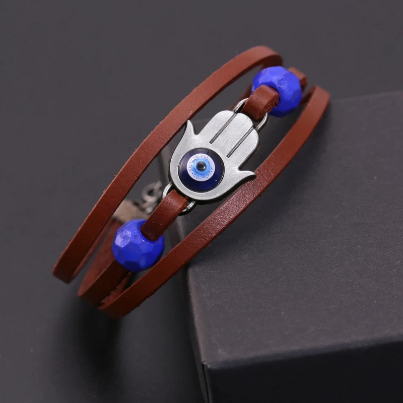 Bracelet de bijoux en cuir avec perles bleues. Accessoire élégant pour hommes et femmes. Design unique et attrayant. Parfait pour toutes occasions.
