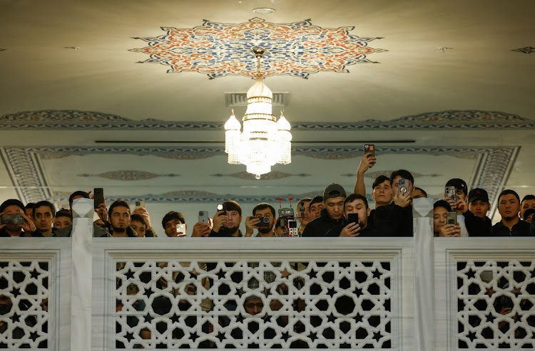 People gather at the Moscow Cathedral Mosque during a ceremony awarding Islam Khalilov, a fifteen-year-old Muslim boy and a cloakroom worker at the Crocus City Hall who saved dozens of people from fire by showing them emergency exits during a terrorist attack on the concert venue, in the city of Moscow, Russia, March 29, 2024. REUTERS/Maxim Shemetov