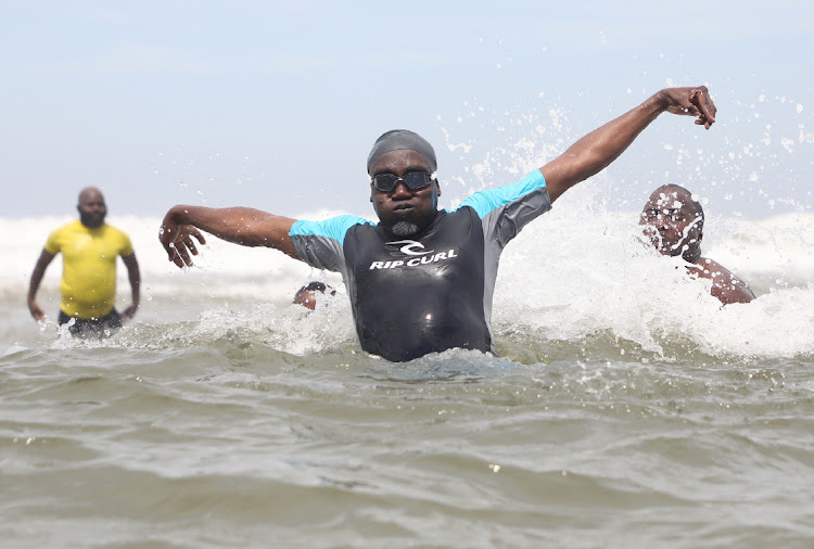 Ethekwini mayor Mxolisi Kaunda goes for a swim at Durban's North Beach last year to prove the water was safe. File photo.