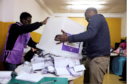 FILE PHOTO: Election officials empty a ballot box during the Ethiopian parliamentary and regional elections, in Addis Ababa, Ethiopia, on June 21, 2021. 