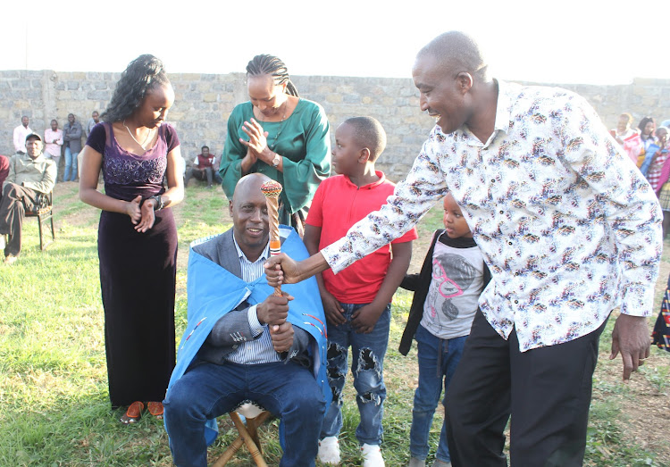 New Kenya National Chamber of Commerce and Industry director South Rift region David Mpatiany is being installed as a Maasai elder at his Narok home following his victory in the elections.