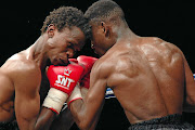 Kgotla Baeti of Botswana, left, punches Ephraim Kabane. Kabasia was always there at the right moment to take a picture.